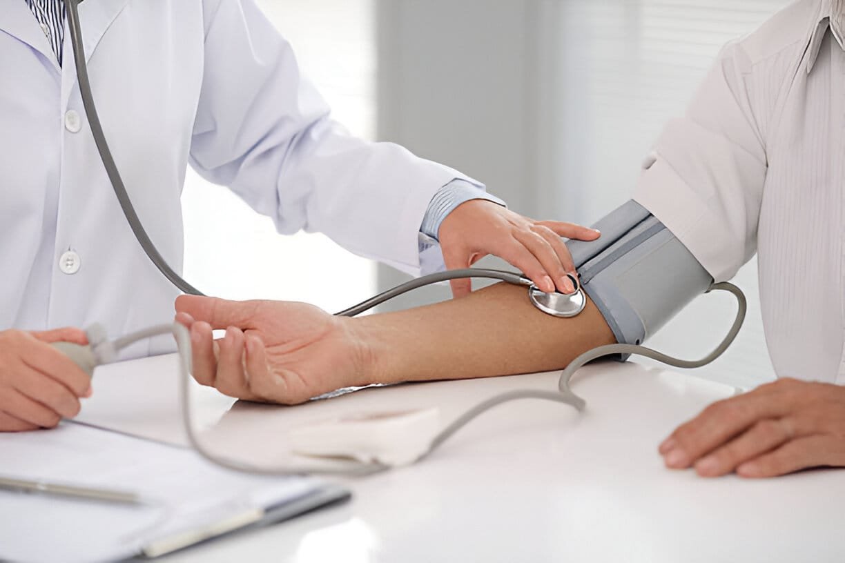 doctor assessing blood pressure