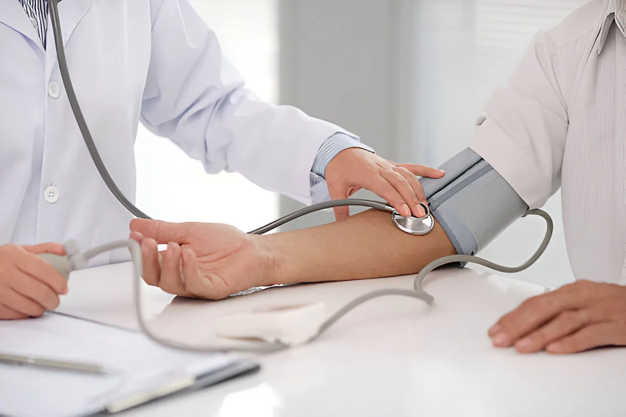 doctor assessing blood pressure
