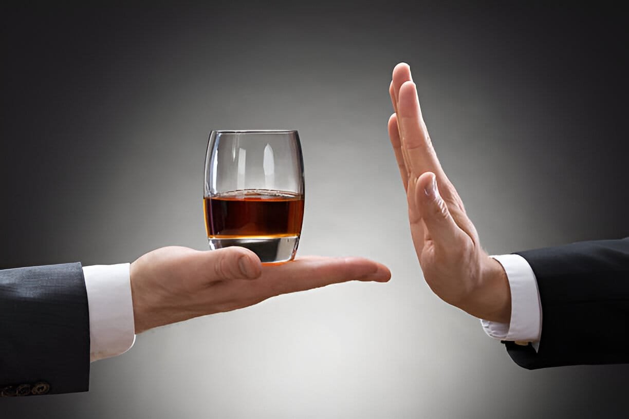 man rejecting alcohol